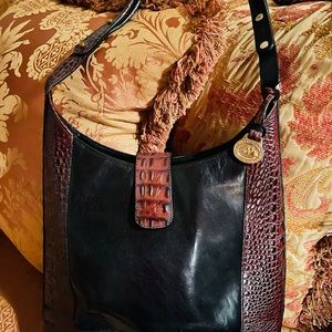 Brahmin leather and crocco embossed leather hobo. Feet in the bottom.
